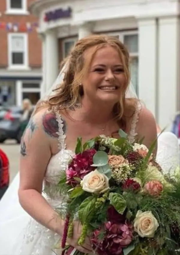 Bride holding a bespoke Flowers By Rosie wedding bouquet