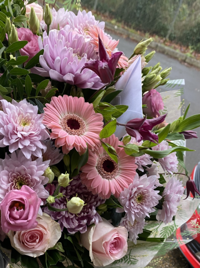 Florist choice in Pinks - A beautiful handtied bouquet of pink flowers , chosen by our Florists to give you the best value for money floral gift.