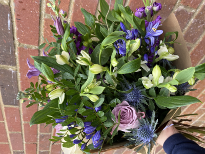 Memory Lane - A mix of alstroemerias, eryngium, agapanthus, scented stocks and roses wrapped in Kraft paper and finished with a raffia bow