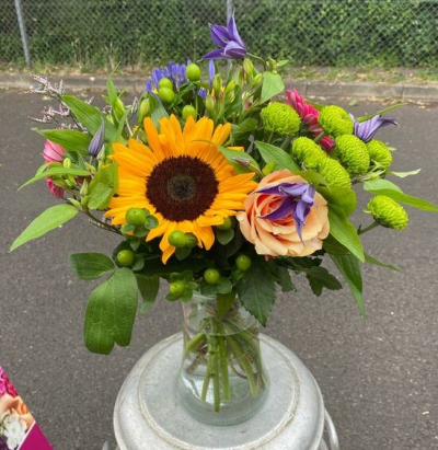 Colour Pop Vase - A vibrant, colourful bouquet bursting with bold sunny tones, fresh greens and contrasting pops of colour.