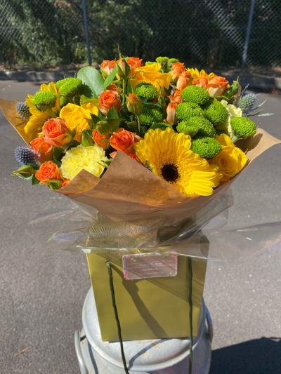 Golden Hour - A vibrant bouquet bursting with sunny yellows, zesty oranges and fresh green tones for a bright, feel-good finish.