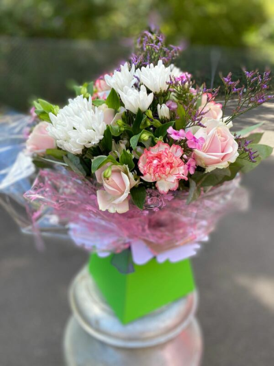 Strawberry Cream - A pretty arrangement of soft pinks and crisp whites, finished with delicate purple accents and fresh greenery.