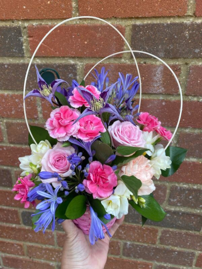 Pink Jewel - A striking arrangement of vibrant pinks, soft rose tones and rich purples, beautifully presented with a contemporary decorative finish.